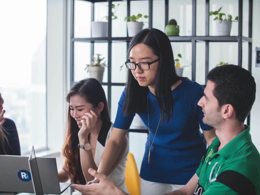 Team meeting discussing why AI recommends competitors over your company and how stronger public authority signals can improve B2B tech visibility.